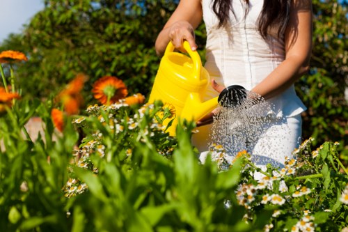 Trained landscaper using protective equipment during maintenance work